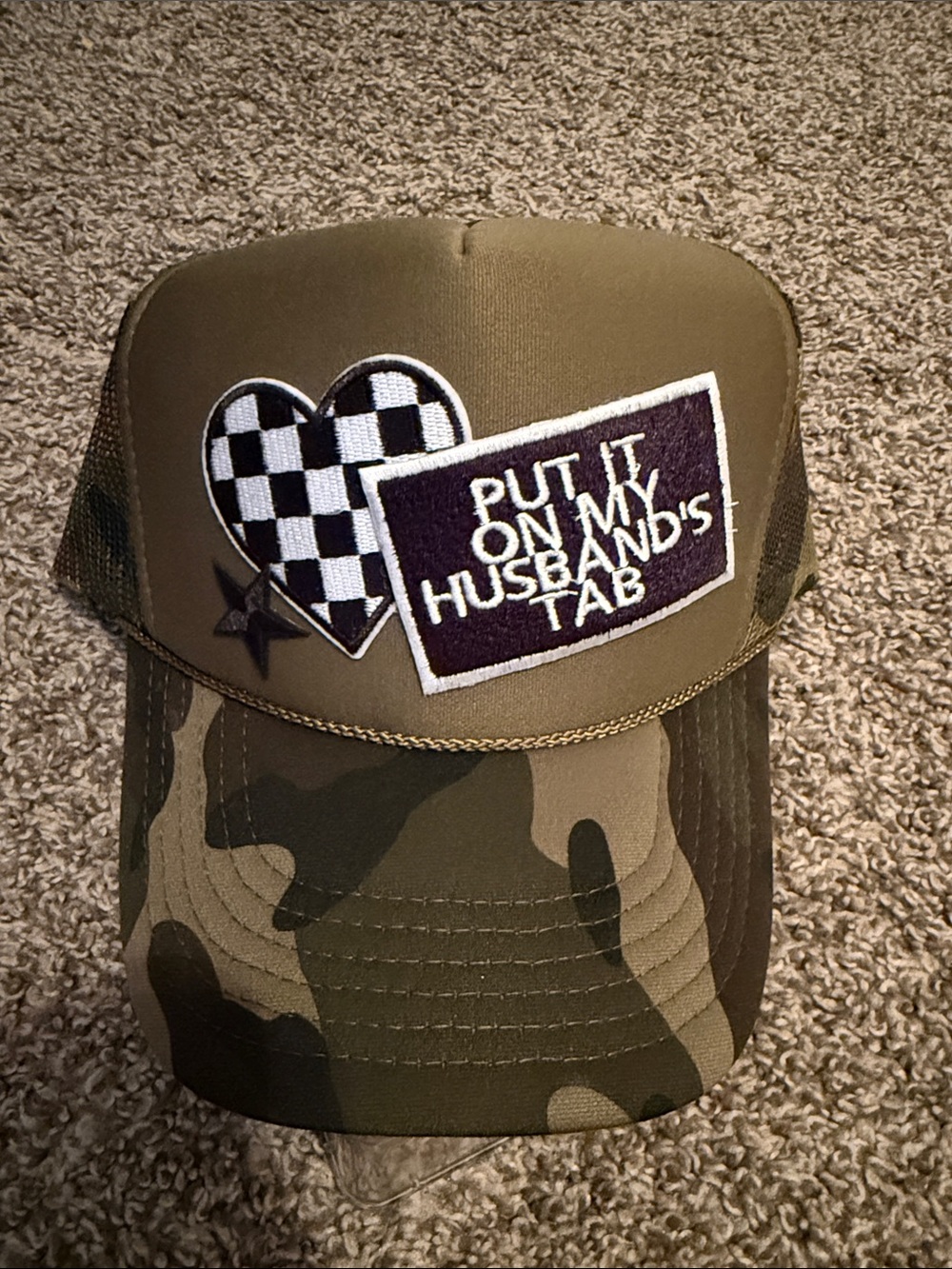 Olive Camo Trucker Hat with 'Put It On My Husband's Tab' Patch